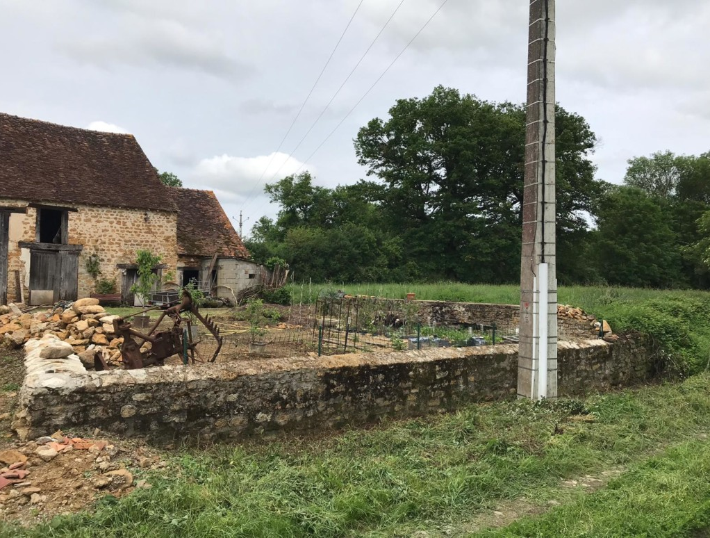 Achtertuin Les Riverons